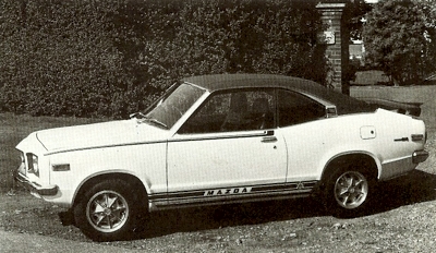A rare publicity shot of a Mazda RX3 in 'Celebration' guise, sporting alloy wheels, boot spoiler and decals
