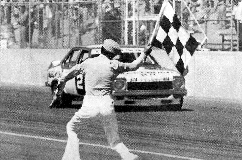 Glen Dix waves Colin Bond over the finish line, 1975
