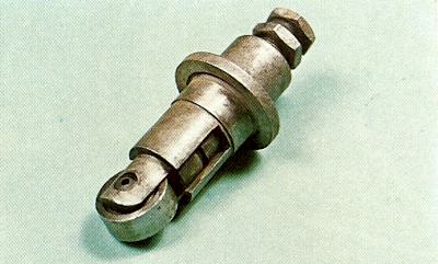 This tappet has a roller to reduce friction between itself and the cam