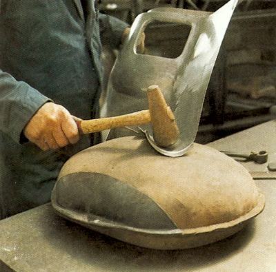 A leather sandbag is used as support when using the blocking hammer