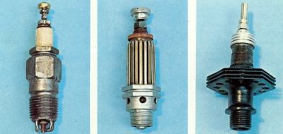 Left: Champion spark plug circa 1901. Centre: Beru spark plug with brass segments, circa 1905. Right: Plug with cooling fins and mica insulator, circa 1967